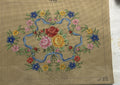 Couronne fleurie au ruban bleu